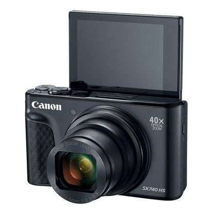 Canon PowerShot SX740 HS, black, front angled view with flip screen raised for selfie