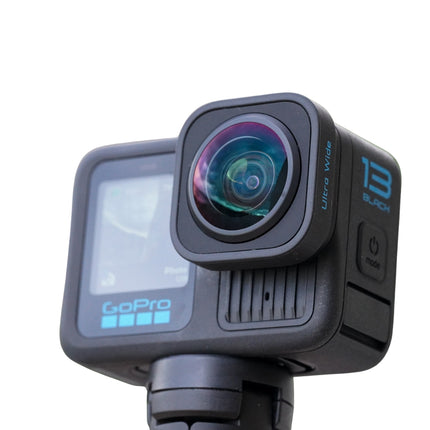 GoPro HERO13 Black Action Camera, black, angled front view with ultra wide lens on selfie stick