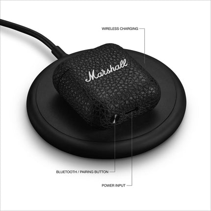 Marshall Minor IV True Wireless Earbuds, black, charging case on wireless charging pad