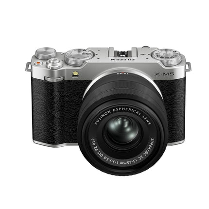 Fujifilm X-M5, silver, front angled view with XC 15-45mm lens attached