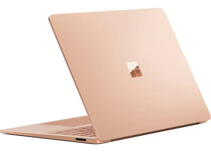 Microsoft Surface Laptop 7, sandstone gold, closed lid rear angled view