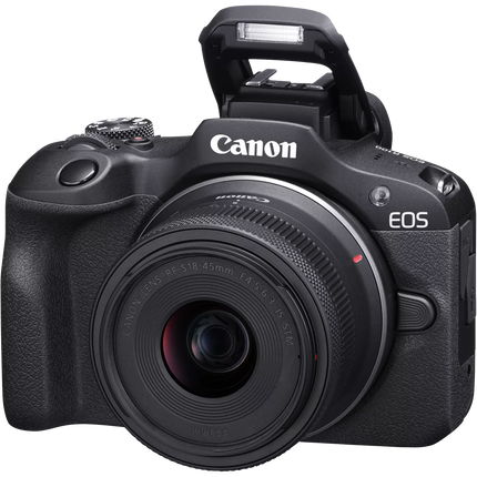 Canon EOS R100 Mirrorless Camera, black, angled front view with lens and flash up