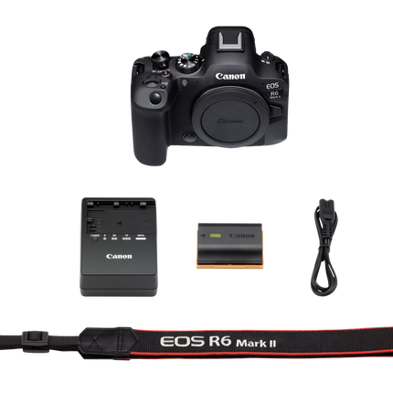 Canon EOS R6 Mark II, black, box contents flat-lay with camera, charger, strap
