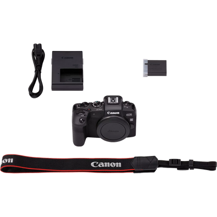 Canon EOS RP, black, box contents flat-lay showing camera body, charger, strap, and accessories