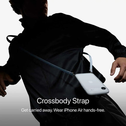 Apple iPhone Air, space black, lifestyle shot with crossbody strap accessory